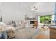 Spacious living room with fireplace and access to a patio at 303 Old Mill Pond Rd # 303, Palm Harbor, FL 34683