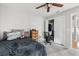 Bedroom with double bed, dresser, and a home office area at 303 Old Mill Pond Rd # 303, Palm Harbor, FL 34683