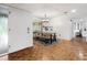 Dining area features wood floors and a rustic farmhouse table at 303 Old Mill Pond Rd # 303, Palm Harbor, FL 34683