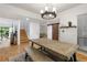 Bright dining room with farmhouse table and bench seating at 303 Old Mill Pond Rd # 303, Palm Harbor, FL 34683
