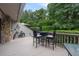 Relaxing deck with seating area and lush green surroundings at 303 Old Mill Pond Rd # 303, Palm Harbor, FL 34683