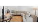 Living room features a large sectional sofa and hardwood floors at 303 Old Mill Pond Rd # 303, Palm Harbor, FL 34683