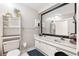 Clean bathroom with double vanity and large mirror at 303 Old Mill Pond Rd # 303, Palm Harbor, FL 34683