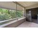 Spacious screened porch with access to the backyard at 303 Old Mill Pond Rd # 303, Palm Harbor, FL 34683