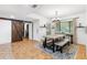 Dining room with farmhouse table, bench seating, and barn door at 303 Old Mill Pond Rd # 303, Palm Harbor, FL 34683