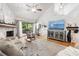 Bright living room with vaulted ceilings, fireplace, and hardwood floors at 303 Old Mill Pond Rd # 303, Palm Harbor, FL 34683