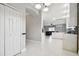 Modern kitchen entry with white cabinets and marble flooring at 1545 Regal Mist Loop, Trinity, FL 34655