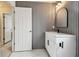 Modern bathroom with white vanity and gray walls at 1545 Regal Mist Loop, Trinity, FL 34655