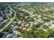 Aerial view showcasing a residential neighborhood at 1218 Gillespie N Dr, Palm Harbor, FL 34684