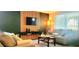 Living room with a modern tv stand and comfortable seating at 3814 Holiday Lake Dr, Holiday, FL 34691