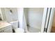 Clean bathroom with a shower/tub combo and black and white checkered floor at 3814 Holiday Lake Dr, Holiday, FL 34691