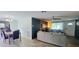 Open concept living and dining area with light flooring at 3814 Holiday Lake Dr, Holiday, FL 34691
