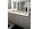 Bright bathroom with double sinks, ample counter space, and modern fixtures at 2077 Wetland Pt # 1103, Lutz, FL 33558