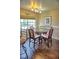 Cozy dining room area with round table, seating for four, and large window at 2077 Wetland Pt # 1103, Lutz, FL 33558