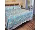 Comfortable main bedroom with queen bed, wood headboard, and access to the balcony at 2077 Wetland Pt # 1103, Lutz, FL 33558