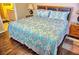 Comfortable main bedroom with queen bed, wood headboard, and ensuite bathroom at 2077 Wetland Pt # 1103, Lutz, FL 33558