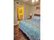 Comfortable main bedroom with queen bed, wood headboard, and ensuite bathroom at 2077 Wetland Pt # 1103, Lutz, FL 33558