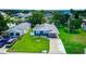 Charming home with manicured lawn, water feature, and water access, creating a serene and inviting outdoor space at 3178 Sea Grape Dr, Hernando Beach, FL 34607