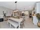 Bright dining area with a farmhouse table and bench seating at 8343 Skye Ranch Blvd, Sarasota, FL 34241