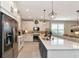 Open concept kitchen with a large island, stainless steel appliances and white cabinets at 8343 Skye Ranch Blvd, Sarasota, FL 34241