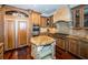Modern kitchen with granite island and stainless steel appliances at 9943 Milano Dr, Trinity, FL 34655