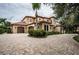Two-story house with a large driveway and landscaping at 9943 Milano Dr, Trinity, FL 34655
