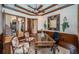 Home office with built-in shelving and hardwood floors at 9943 Milano Dr, Trinity, FL 34655