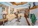 Open living room showcasing hardwood floors and views to kitchen at 9943 Milano Dr, Trinity, FL 34655