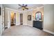 Large bedroom with carpeted floors and access to a hallway at 9943 Milano Dr, Trinity, FL 34655