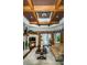 Living room features a cozy fireplace, hardwood floors, and high ceilings at 9943 Milano Dr, Trinity, FL 34655