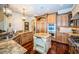 Spacious kitchen with island, granite countertops, and stainless steel appliances at 9943 Milano Dr, Trinity, FL 34655
