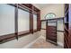 Custom-designed walk-in closet with built-in shelves and drawers at 9943 Milano Dr, Trinity, FL 34655