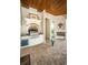 Covered outdoor kitchen with grill, cabinetry, and tiled flooring at 9943 Milano Dr, Trinity, FL 34655