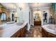 Spacious bathroom with and vanities and a large soaking tub at 9943 Milano Dr, Trinity, FL 34655