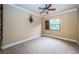 Bright bedroom with carpeted floor and ceiling fan at 9943 Milano Dr, Trinity, FL 34655