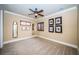 Spacious bedroom with carpeted floors and plantation shutters at 9943 Milano Dr, Trinity, FL 34655