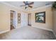 Spacious bedroom with plush carpeting, neutral walls, and access to a private bathroom at 9943 Milano Dr, Trinity, FL 34655