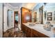 Bathroom features a large vanity with vessel sink and ample storage at 9943 Milano Dr, Trinity, FL 34655