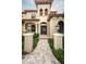Front entrance with double doors and stone pathway at 9943 Milano Dr, Trinity, FL 34655