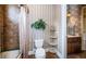 Simple bathroom with shower, toilet, and decorative accents at 9943 Milano Dr, Trinity, FL 34655