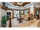 Spacious living room with stone fireplace and hardwood floors at 9943 Milano Dr, Trinity, FL 34655