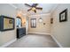 Well-lit bedroom with carpeted floors and ceiling fan at 9943 Milano Dr, Trinity, FL 34655