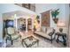 Elegant living room features high ceilings, a large sofa, and a glass coffee table at 9943 Milano Dr, Trinity, FL 34655