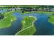 Community overview showcasing a golf course and lake at 9943 Milano Dr, Trinity, FL 34655