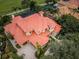 Luxury home with red tile roof and pool at 9943 Milano Dr, Trinity, FL 34655