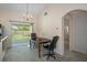 Bright dining area with a wooden table, chairs, and access to the backyard at 4336 Lightfoot St, Spring Hill, FL 34609