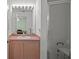 Clean bathroom with single sink vanity and shower at 4336 Lightfoot St, Spring Hill, FL 34609