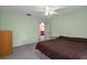 Spacious bedroom with ceiling fan and plush carpet at 4336 Lightfoot St, Spring Hill, FL 34609