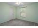 Cozy bedroom with window, ceiling fan and carpet at 4336 Lightfoot St, Spring Hill, FL 34609