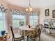 Cozy breakfast nook with a round table and view to backyard at 17425 Eagle Trace Dr, Brooksville, FL 34604